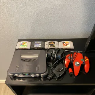 Photo of Nintendo 64 + Games + Cables + Controller 